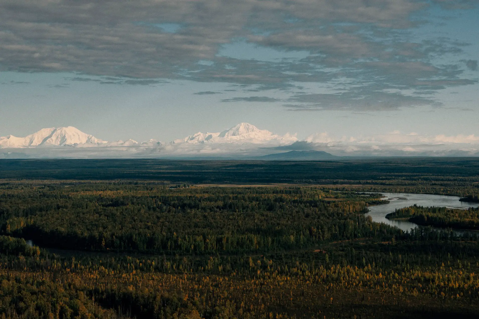 View of the Yentna River with Denali in the background near Lake Creek Lodge in Alaska